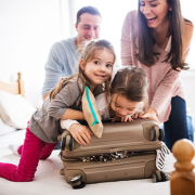 Family packing a suitcase
