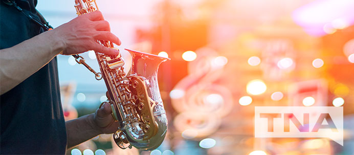Man playing saxophone at blues festival