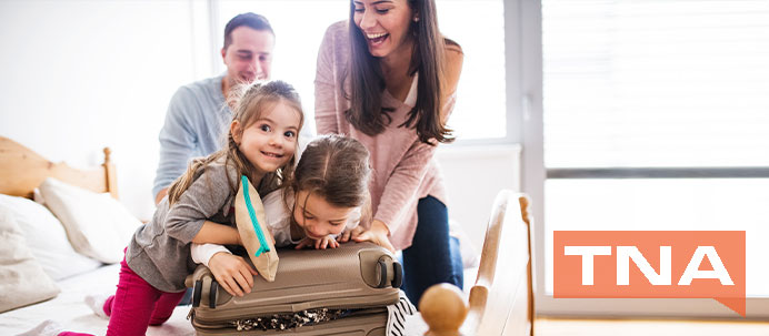 Family packing a suitcase