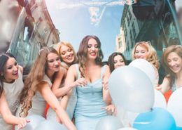 Hens Party in front of a hire party bus